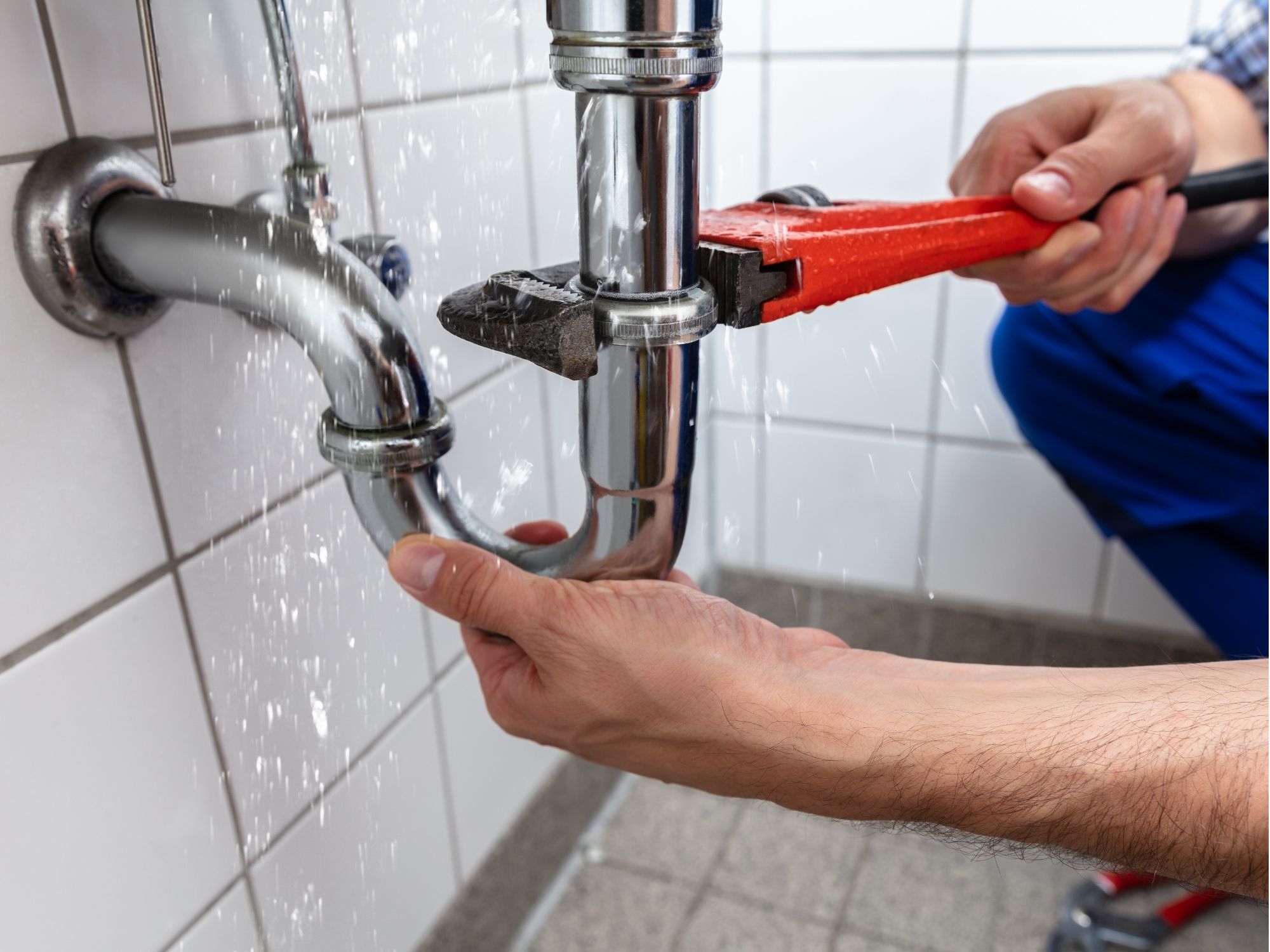 Plumber repairing active leak